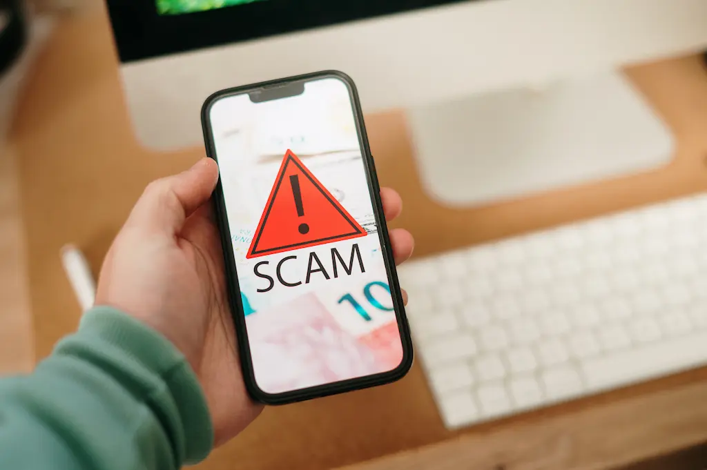 crypto scam text message smartphone warning